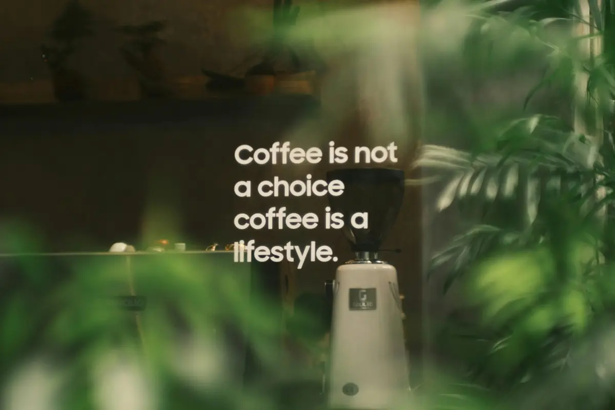 Coffee lifestyle image showing brewing equipment on a wooden counter
